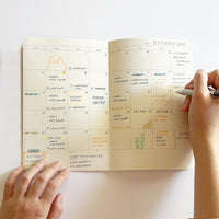 Compact 12 months Planner
